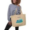 Large organic cotton tote bag in linen color with dual straps, ideal for groceries or travel.