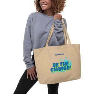 Large organic cotton tote bag in linen color with dual straps, ideal for groceries or travel.