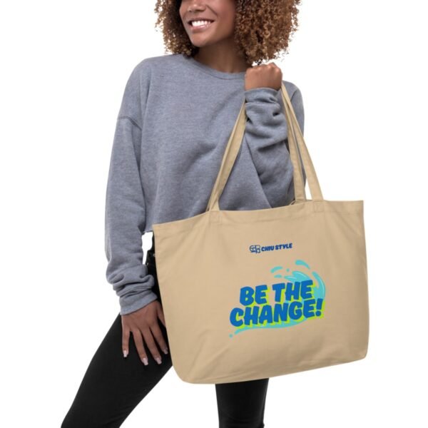 Large organic cotton tote bag in linen color with dual straps, ideal for groceries or travel.