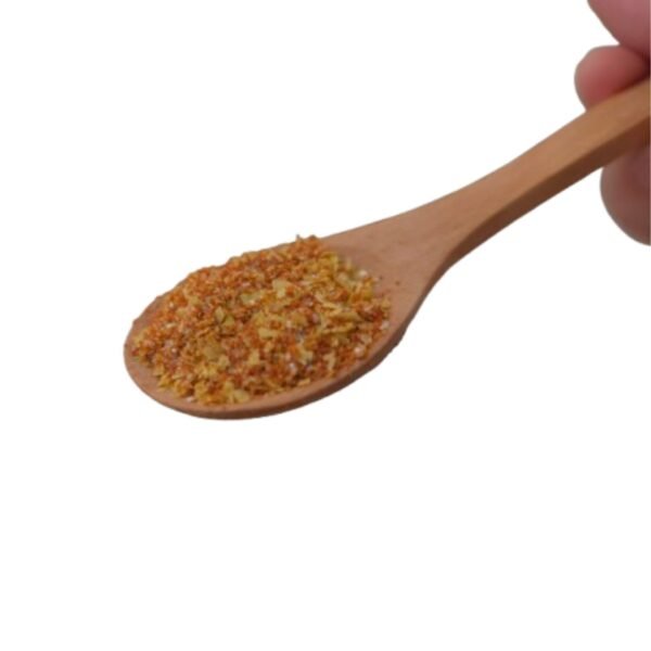 Kimchi-Flavored Seasoning powder on a wooden spoon showing texture and color