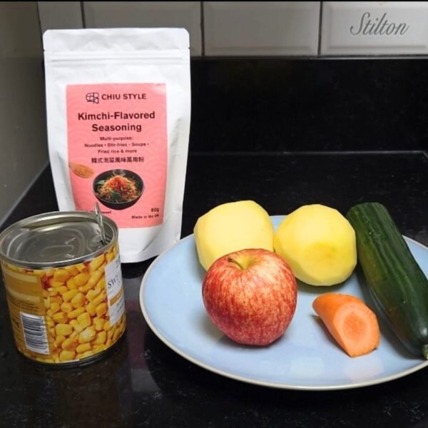 Kimchi-Flavored Seasoning pouch with apples, potatoes, corn, and cucumber for salad ingredients