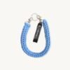 Front view of the CHIU STYLE Classic Logo Vegan Leather Braided Keychain in vibrant Cornflower Blue with embossed tag.