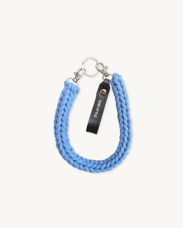 Front view of the CHIU STYLE Classic Logo Vegan Leather Braided Keychain in vibrant Cornflower Blue with embossed tag.