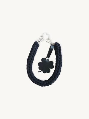 Front view of the CHIU STYLE clover vegan leather braided keychain in classic black, featuring a matching die-cut four-leaf clover tag and polished silver hardware