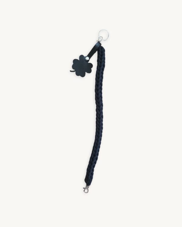 Full length straight view of the 36-38cm CHIU STYLE clover vegan leather braided keychain in classic black, highlighting its complete structure and clover tag