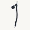 Full length straight view of the 36-38cm CHIU STYLE clover vegan leather braided keychain in black with silver thread, highlighting its complete structure and clover tag