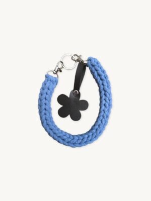 Front view of the CHIU STYLE floral vegan leather braided keychain in Cornflowers Blue, featuring a burnt umber die-cut flower tag and polished silver hardware
