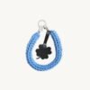 Front view of the CHIU STYLE clover vegan leather braided keychain in cornflower blue, featuring a matching die-cut four-leaf clover tag and polished silver hardware