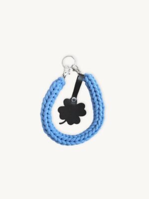 Front view of the CHIU STYLE clover vegan leather braided keychain in cornflower blue, featuring a matching die-cut four-leaf clover tag and polished silver hardware