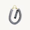 Front view of the CHIU STYLE vegan leather braided keychain in Earth Mocha, featuring a rich warm brown logo tag and dual metal clasps