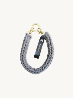 Front view of the CHIU STYLE vegan leather braided keychain in Earth Mocha, featuring a rich warm brown logo tag and dual metal clasps