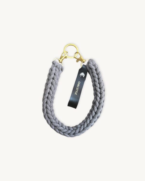 Front view of the CHIU STYLE vegan leather braided keychain in Earth Mocha, featuring a rich warm brown logo tag and dual metal clasps