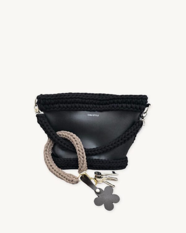 Mocha floral vegan leather braided keychain looped around a tote bag handle, demonstrating easy key access inside a handbag