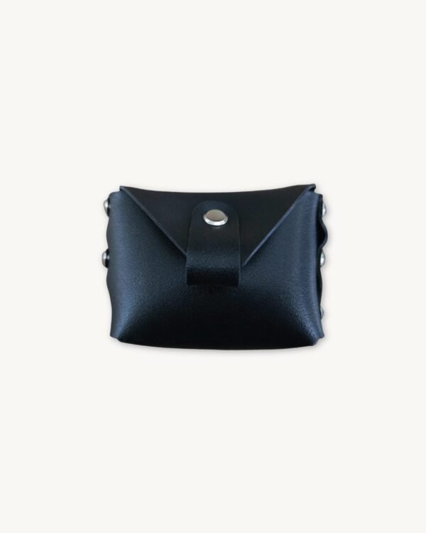 Black minimalist vegan leather micro wallet front view showing raw edges and two Chicago screws securing the industrial design.