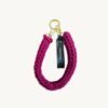 Front view of the CHIU STYLE vegan leather braided keychain in Sangria, featuring a rich warm brown logo tag and polished metal clasps