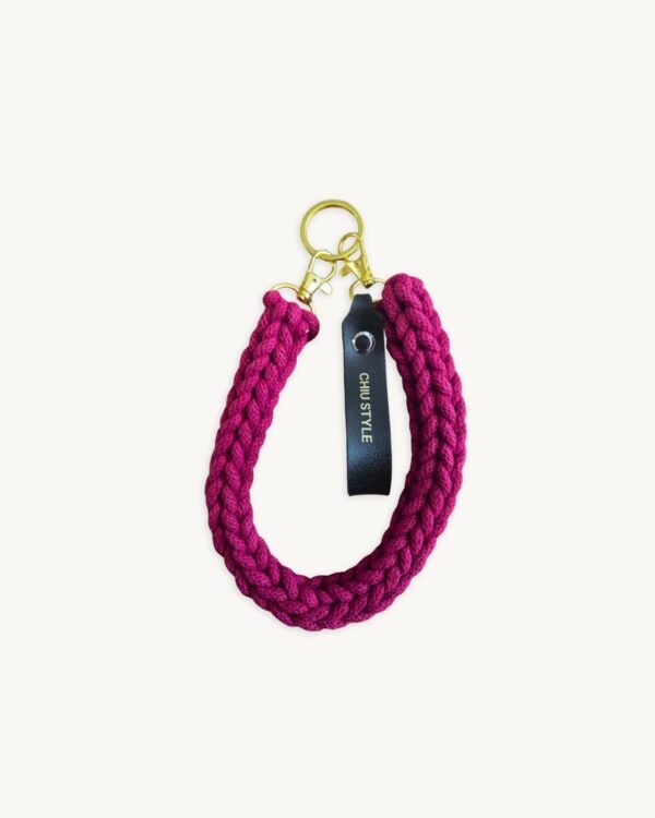 Front view of the CHIU STYLE vegan leather braided keychain in Sangria, featuring a rich warm brown logo tag and polished metal clasps