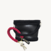 Sangria vegan leather braided keychain looped around a leather tote bag handle, demonstrating easy key access inside handbag