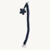 Full length straight view of the 36-38cm CHIU STYLE floral vegan leather braided keychain in Black with Silver Thread, highlighting its complete structure and flower tag