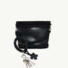 Black with Silver Thread floral vegan leather braided keychain looped around a tote bag handle, demonstrating easy key access inside a handbag
