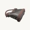 Dark Brown Vintage Punk Vegan Leather Classic Handbag resting sideways on a table showing the structured bottom view