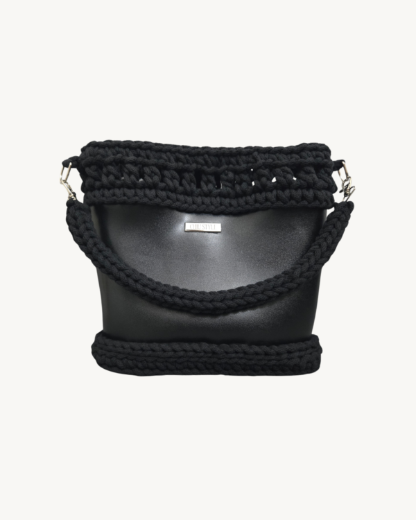 Front view of Vintage Punk Vegan Leather Laced Rhythm Handbag in black featuring intricate crochet texture and handle resting on the front body