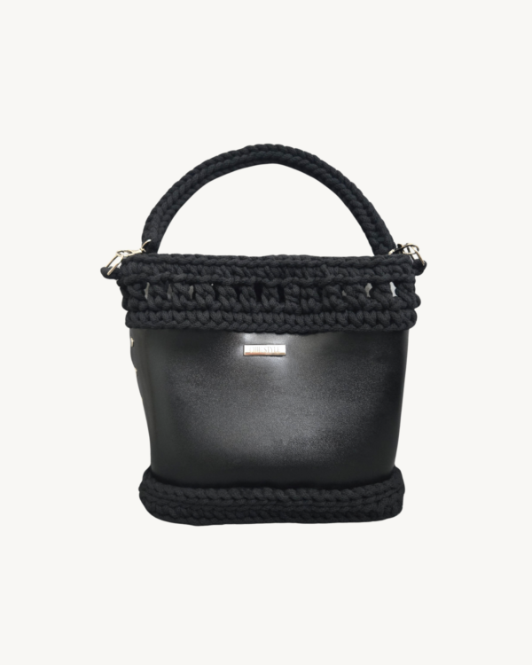 Front view of Vintage Punk Vegan Leather Laced Rhythm Handbag in black with intricate crochet texture and suspended i-cord handle