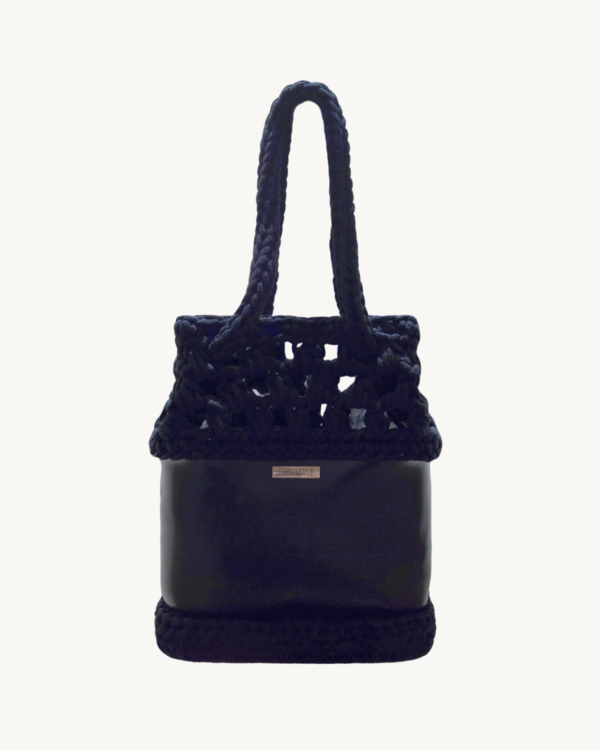 Vintage Punk vegan leather black drawstring bag featuring an artisanal puff-stitch openwork upper and smooth I-cord handles.