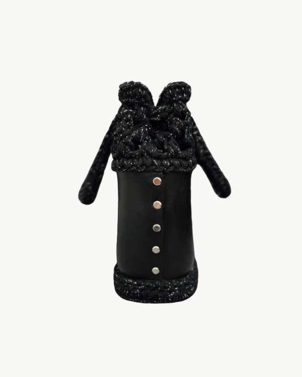 Side view of the Vintage Punk vegan leather drawstring bag in black with silver thread, highlighting the structured side construction secured with metallic Chicago screws.