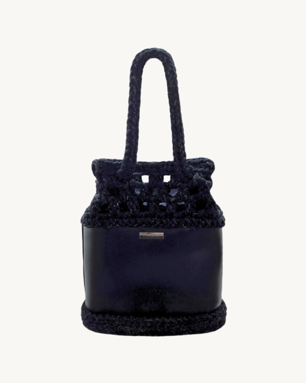 Vintage Punk vegan leather drawstring bag in black with silver thread, featuring an artisanal puff-stitch openwork upper and smooth I-cord handles.