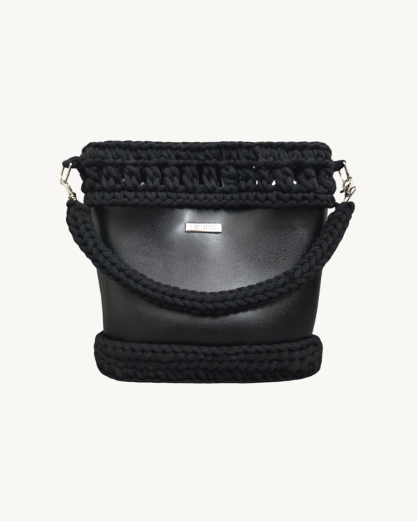 Front view of Vintage Punk Vegan Leather Laced Rhythm Handbag in black featuring intricate crochet texture and handle resting on the front body