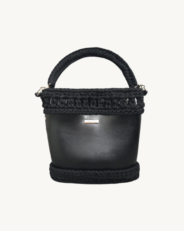 Front view of Vintage Punk Vegan Leather Laced Rhythm Handbag in black with intricate crochet texture and suspended i-cord handle