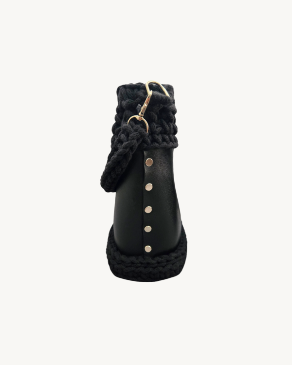 Side view of Vintage Punk Vegan Leather Laced Rhythm Handbag in black showcasing Chicago screw hardware and textured profile