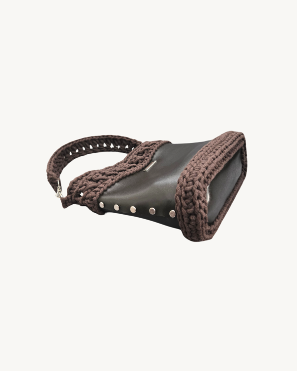 Vintage-Punk-Vegan-Leather-Lattice-Weave-Handbag-Dark-Brown-Side-Lying-Bottom-View Side-lying view of Vintage Punk Vegan Leather Lattice Weave Handbag in dark brown showing the structured bottom, Chicago screws, and lattice texture